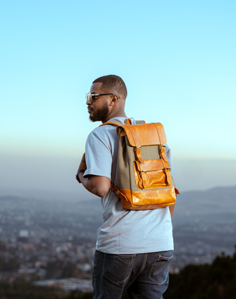 Man carrying a sabawiyan leather bag on a mountain top in Addis Ababa